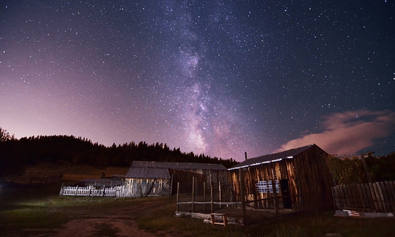 Milky Way seen at night over a barn at Walker Ranch
