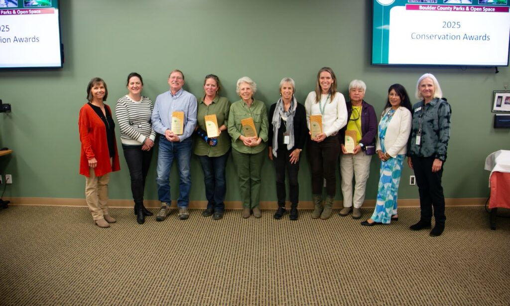 Conservation award winners stand with their awards with Boulder County staff.