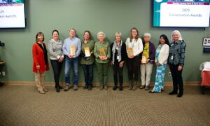 Conservation award winners stand with their awards with Boulder County staff.