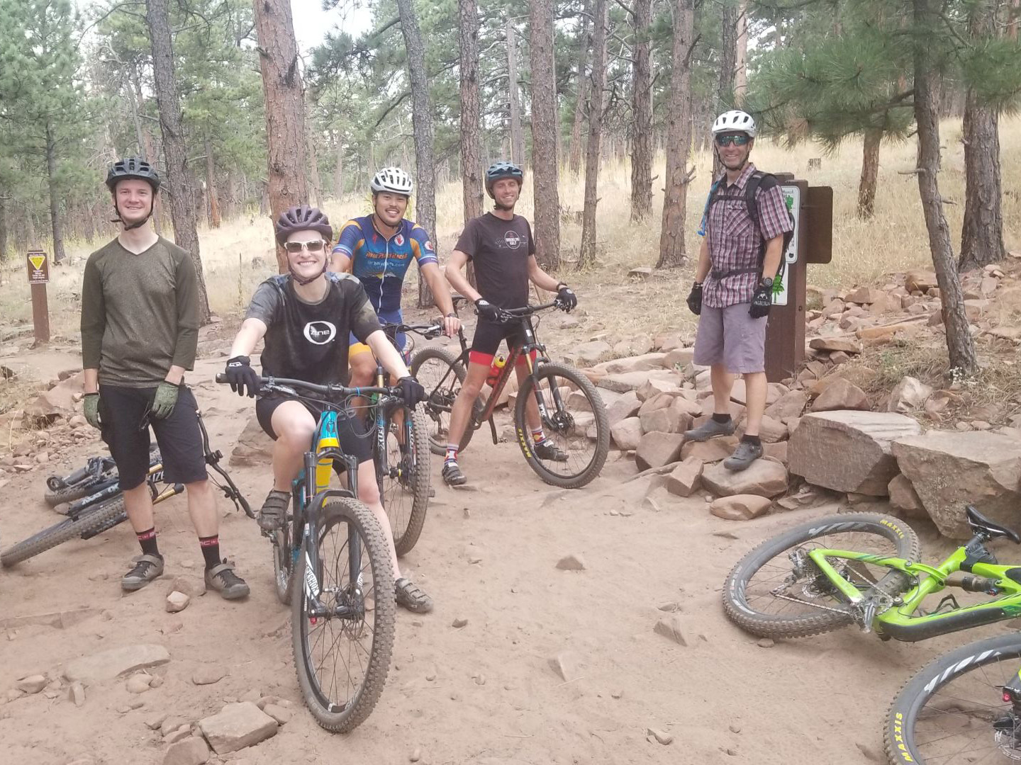 Group of mountain bikers getting ready to pick up trash